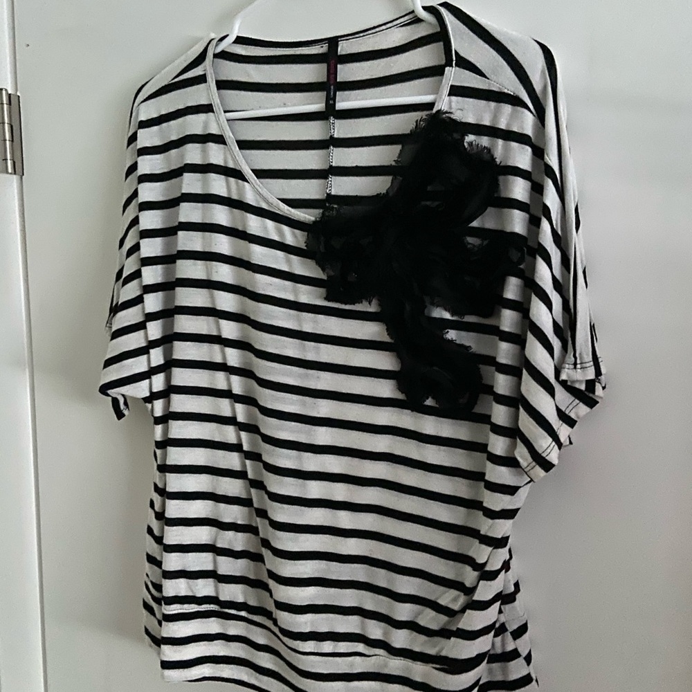 Striped top with statement bow